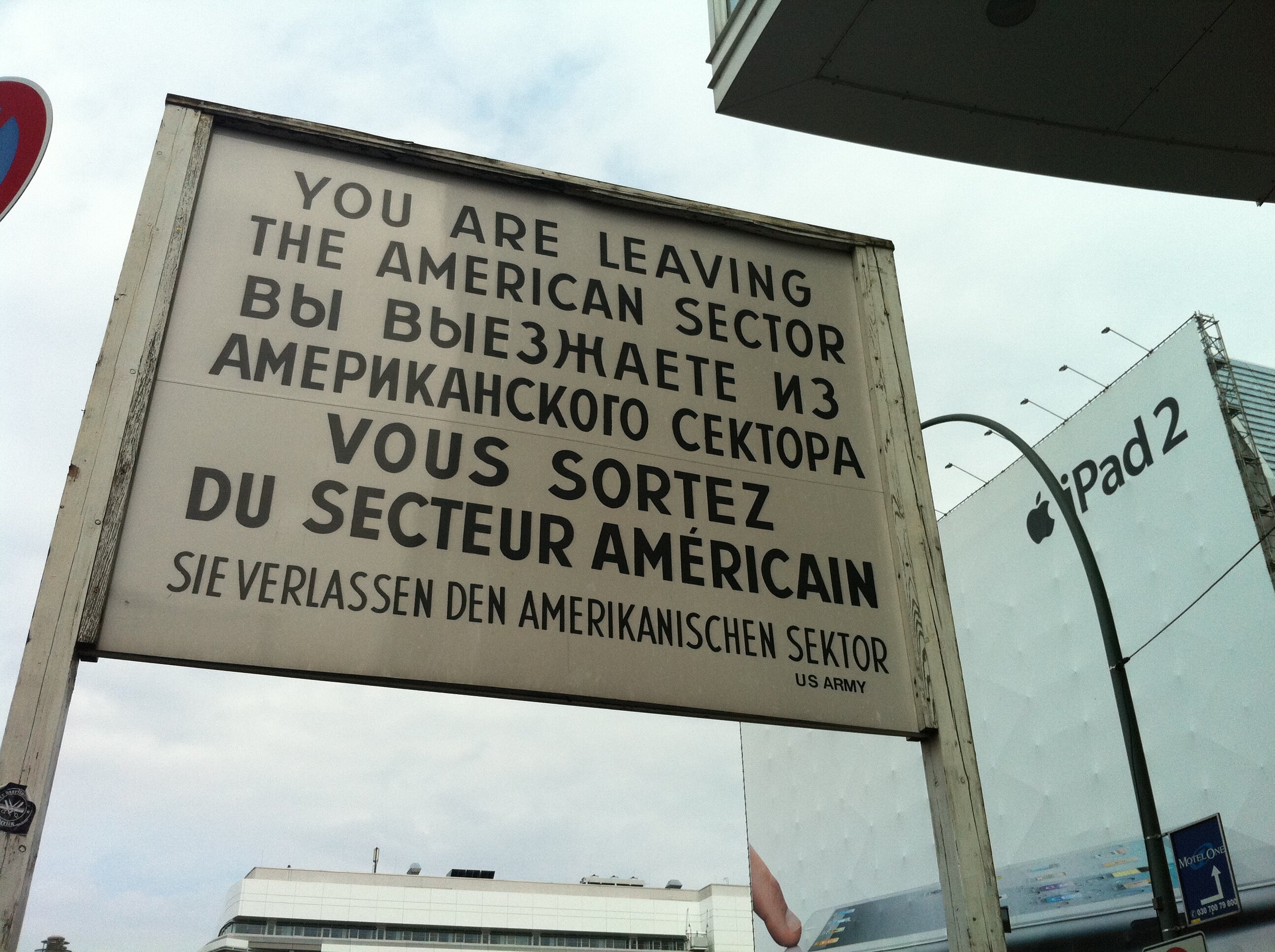 Checkpoint Charlie and iPad 2 sign, Berlin, Germany